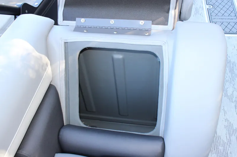 Slide: The Image of Starcraft EXS 3 2026 boat storage compartment with open lid, showcasing interior space. - 20
