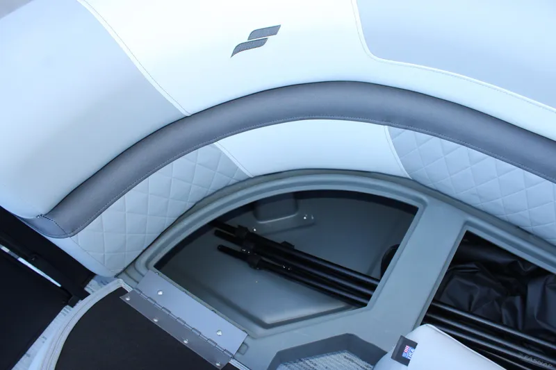 Slide: The Image of 2026 Starcraft EXS 3 boat interior with quilted upholstery and storage compartment. - 31