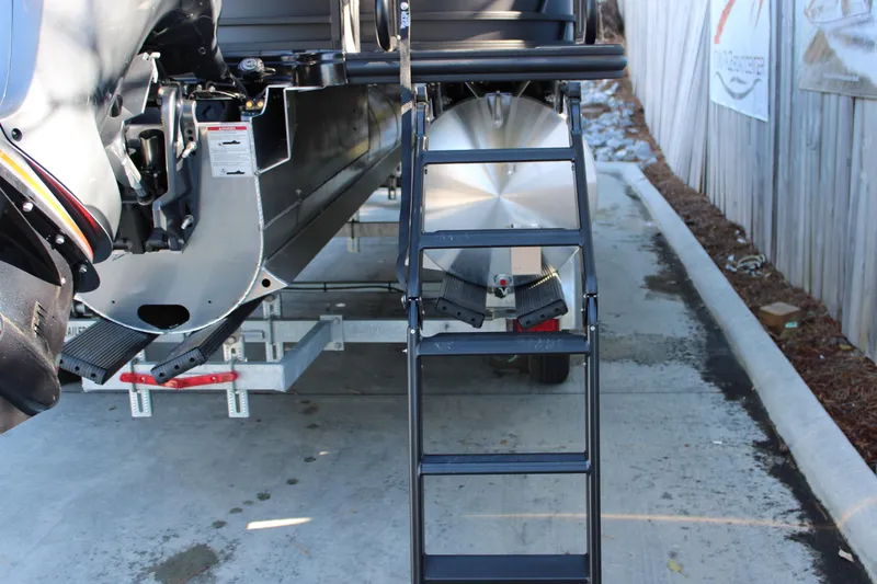 Slide: The Image of Rear view of 2026 Starcraft EXS 3 boat with ladder and trailer. - 7