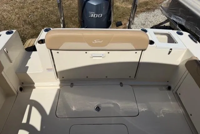 Slide: The Image of 2021 Scout 235 Dorado boat interior with Yamaha 300 engine, beige seating. - 9