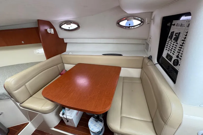 Slide: The Image of 2005 Pro-Line 33 Express cabin interior with dining area and control panel. - 25