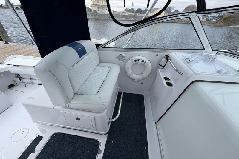 Slide: The Image of 2005 Pro-Line 33 Express boat interior with seating and life preserver. - 5