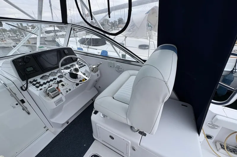 Slide: The Image of 2005 Pro-Line 33 Express boat cockpit with steering wheel and control panel. - 9