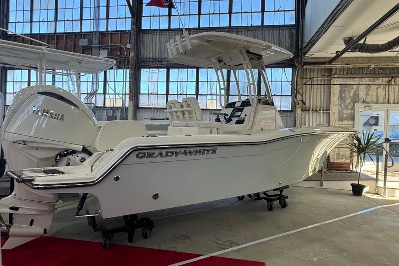 The Image of 2025 Grady-White Fisherman 216 boat in showroom, featuring Yamaha engine. - 1