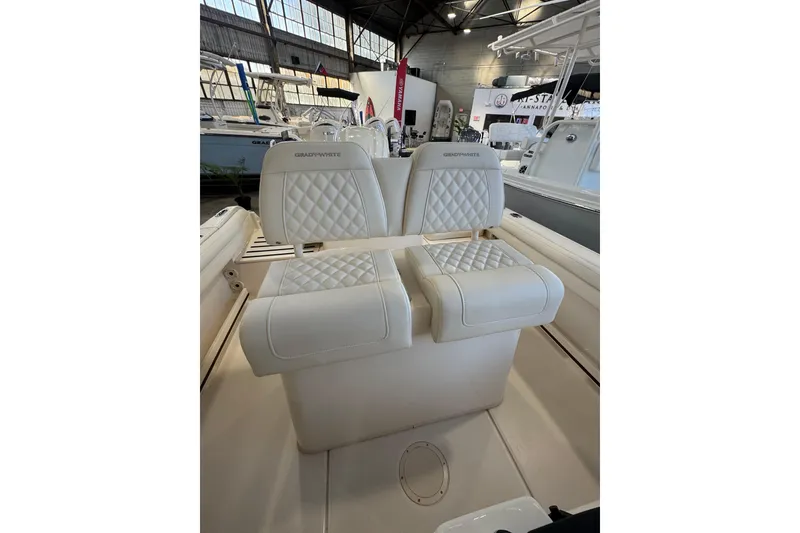 Slide: The Image of 2025 Grady-White Fisherman 216 boat seats with quilted design in a showroom. - 5