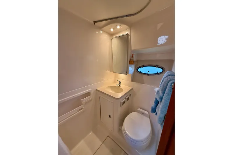 Slide: The Image of Luxurious cabin interior of 2005 Tiara 3600 Open yacht with patterned bedding. - 26