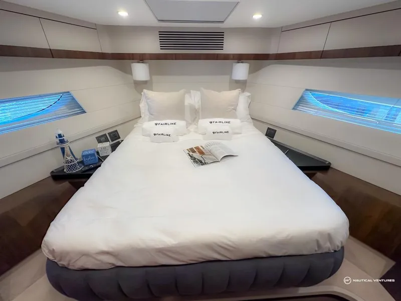 Slide: The Image of Luxurious bedroom in 2023 Fairline Phantom 65 yacht with modern decor and cozy bedding. - 38