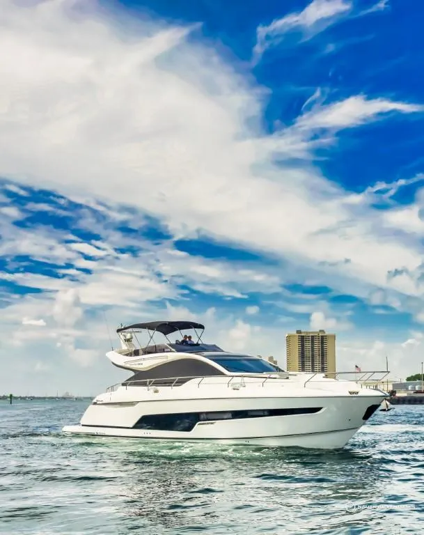 Slide: The Image of 2023 Fairline Phantom 65 yacht cruising on a sunny day. - 5