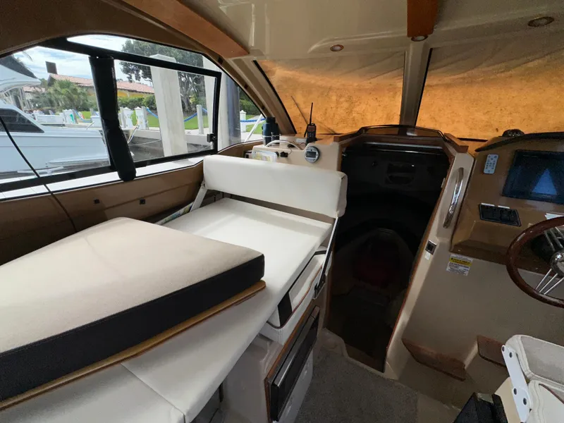 Slide: The Image of Interior of 2016 Cutwater C 24 Coupe boat with seating and helm. - 13