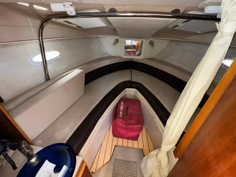 Slide: The Image of 2016 Cutwater C 24 Coupe cabin interior with seating and storage. - 14