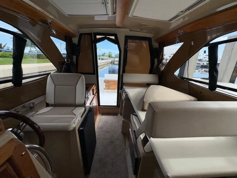 Slide: The Image of Interior of 2016 Cutwater C 24 Coupe boat, featuring seating and helm station. - 17