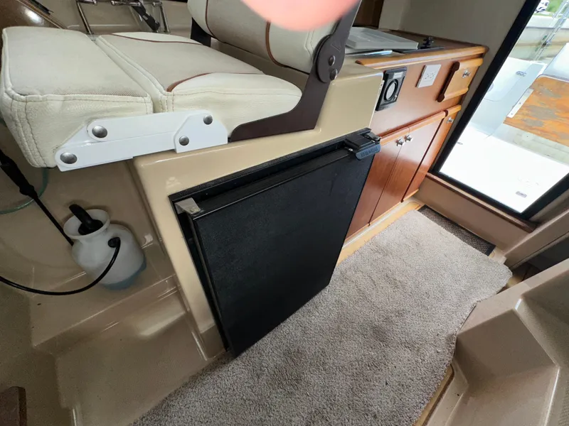 Slide: The Image of Interior of 2016 Cutwater C 24 Coupe with seating and kitchenette area. - 18