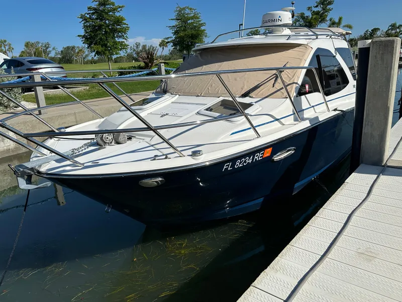Slide: The Image of 2016 Cutwater C 24 Coupe docked at marina, sunny day. - 3