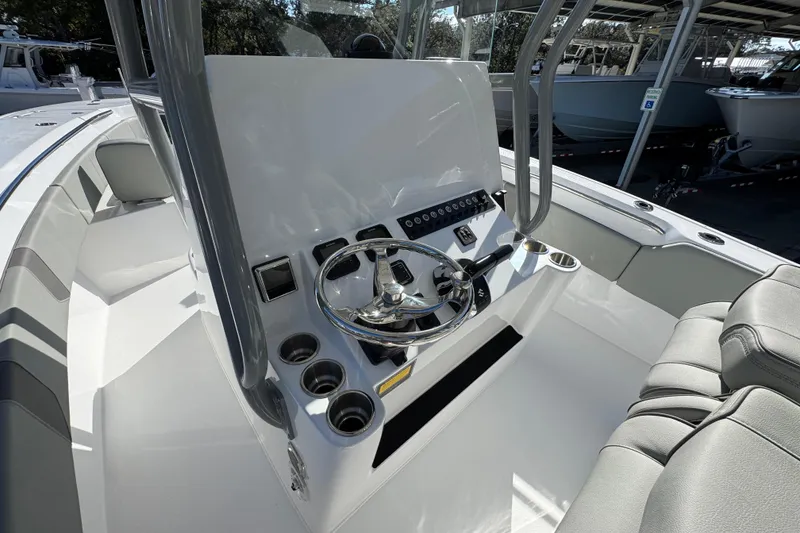Slide: The Image of 2026 Cape Horn 32 XS boat interior with modern steering console and seating. - 28