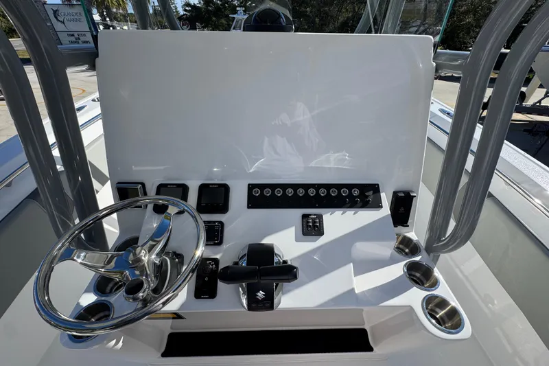 Slide: The Image of 2026 Cape Horn 32 XS boat dashboard with steering wheel and control panel. - 29