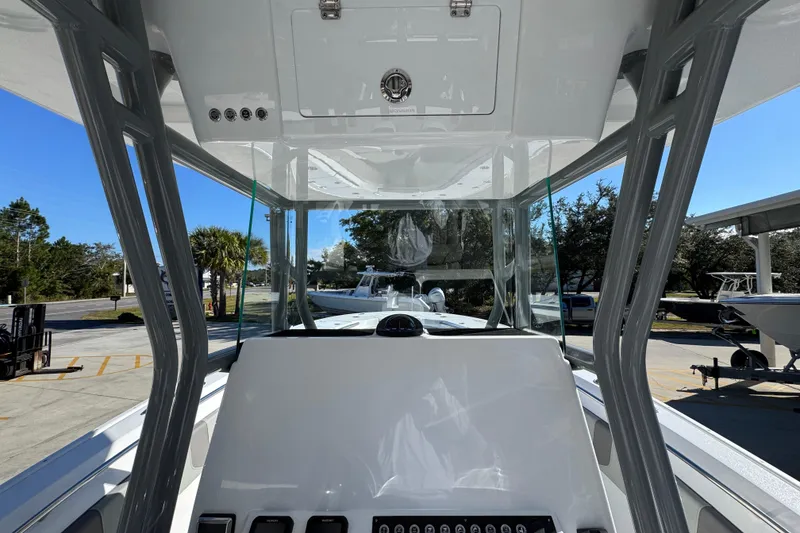 Slide: The Image of 2026 Cape Horn 32 XS boat interior with modern console and clear canopy. - 30