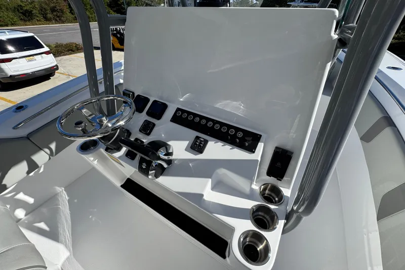 Slide: The Image of 2026 Cape Horn 32 XS boat console with steering wheel and control panel. - 31