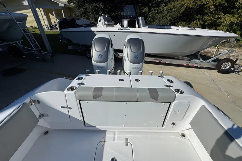 Slide: The Image of 2026 Cape Horn 32 XS boat with dual Suzuki 350 engines, parked on a trailer. - 39