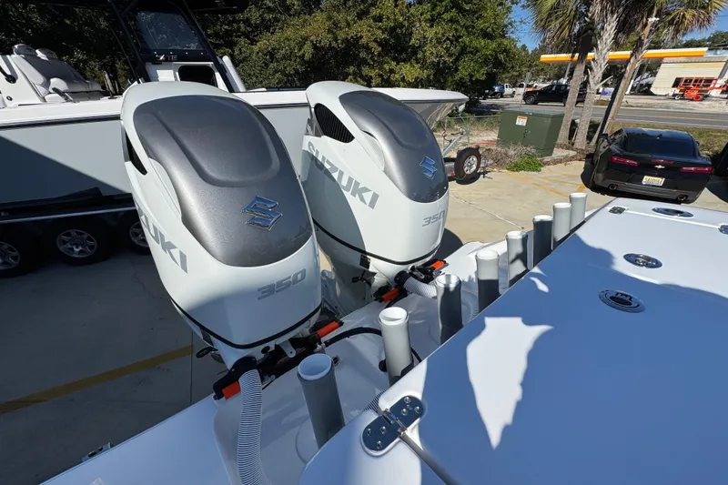 Slide: The Image of 2026 Cape Horn 32 XS boat with dual Suzuki 350 outboard engines in a sunny outdoor setting. - 41