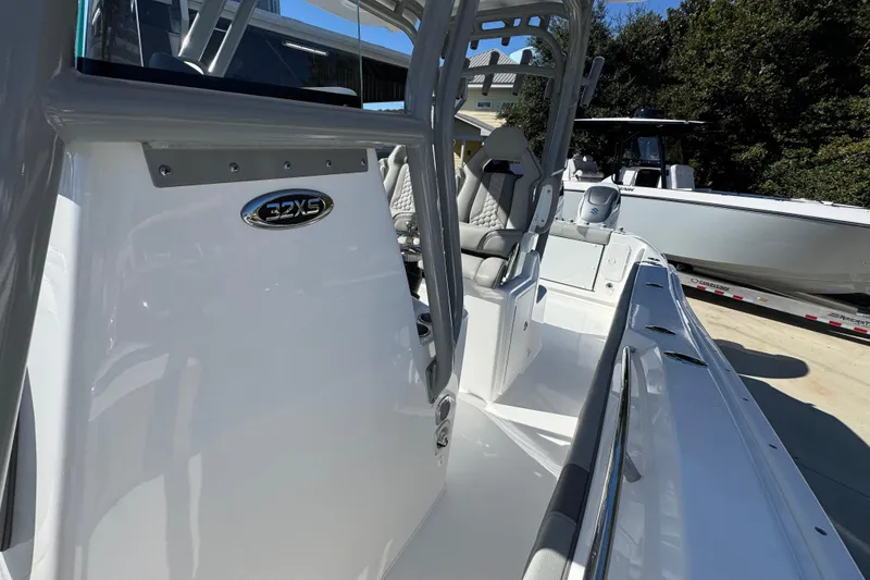Slide: The Image of 2026 Cape Horn 32 XS boat, sleek design, white exterior, outdoor setting. - 25
