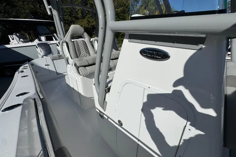 Slide: The Image of 2026 Cape Horn 32 XS boat interior with seating and console details. - 26