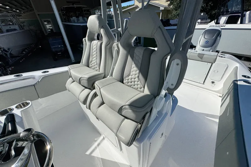 Slide: The Image of 2026 Cape Horn 32 XS boat with luxurious dual captain's seats in a sleek design. - 32