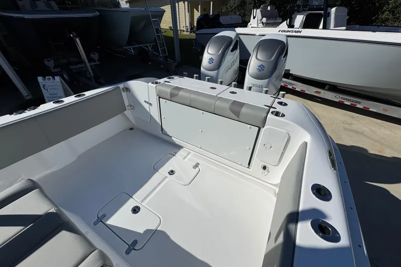 Slide: The Image of 2026 Cape Horn 32 XS boat interior with dual Suzuki engines, docked outdoors. - 38