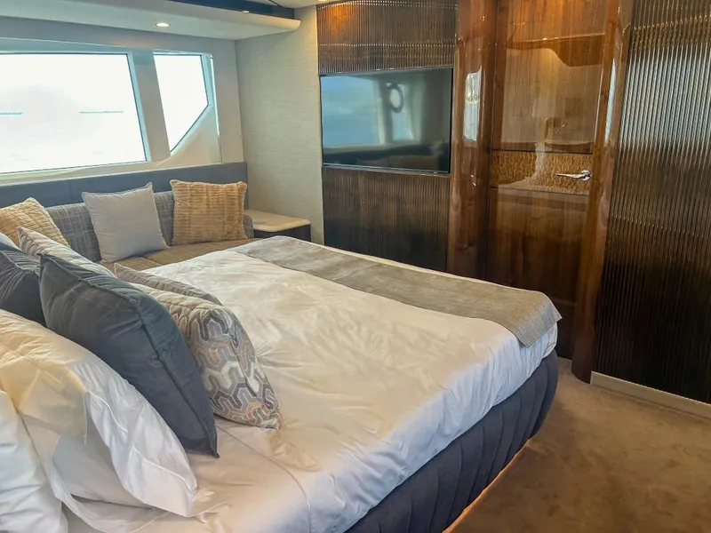 Slide: The Image of Luxurious bedroom interior of 2024 Fairline Squadron 68 yacht with modern decor. - 23