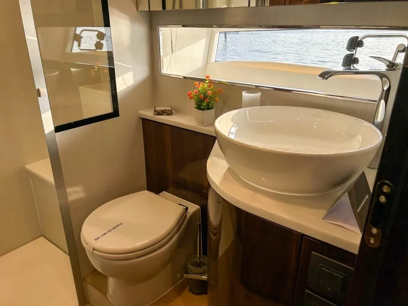 Slide: The Image of Modern bathroom in 2024 Fairline Squadron 68 yacht with vessel sink and sea view. - 30