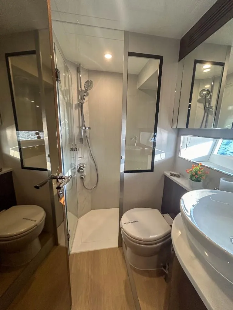 Slide: The Image of 2024 Fairline Squadron 68 yacht bathroom with modern shower and fixtures. - 31