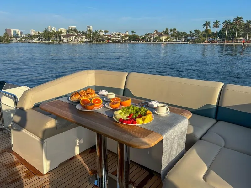 Slide: The Image of Luxury breakfast setup on 2024 Fairline Squadron 68 yacht with waterfront view. - 37