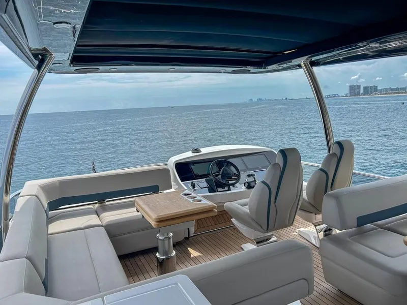 Slide: The Image of Fairline Squadron 68 2024 yacht interior with ocean view and luxury seating. - 40