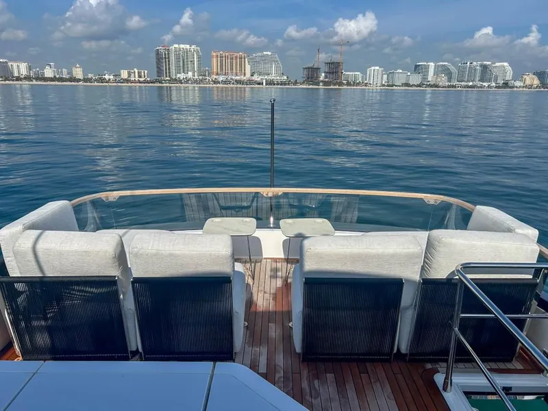 Slide: The Image of 2024 Fairline Squadron 68 yacht deck with ocean and city skyline view. - 44