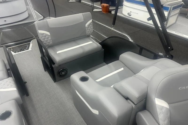 Slide: The Image of Interior of 2025 Crest Classic 220 boat with gray seating and modern design. - 8
