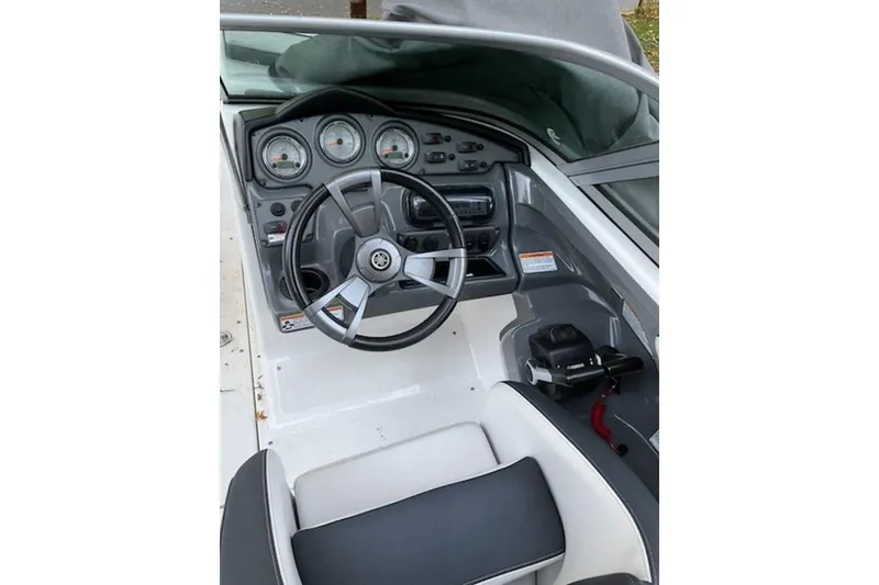 Slide: The Image of 2015 Yamaha Boats SX210 dashboard with steering wheel and gauges. - 5