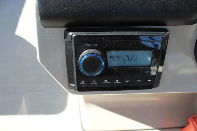 Slide: The Image of Clarion audio system on 2025 Harris Cruiser 230 boat dashboard. - 16