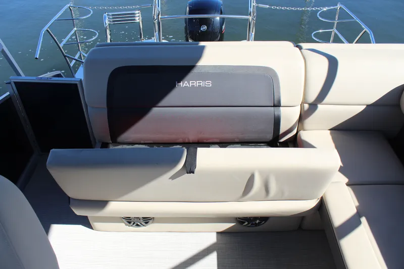 Slide: The Image of 2025 Harris Cruiser 230 boat interior with beige seating and backrest. - 19