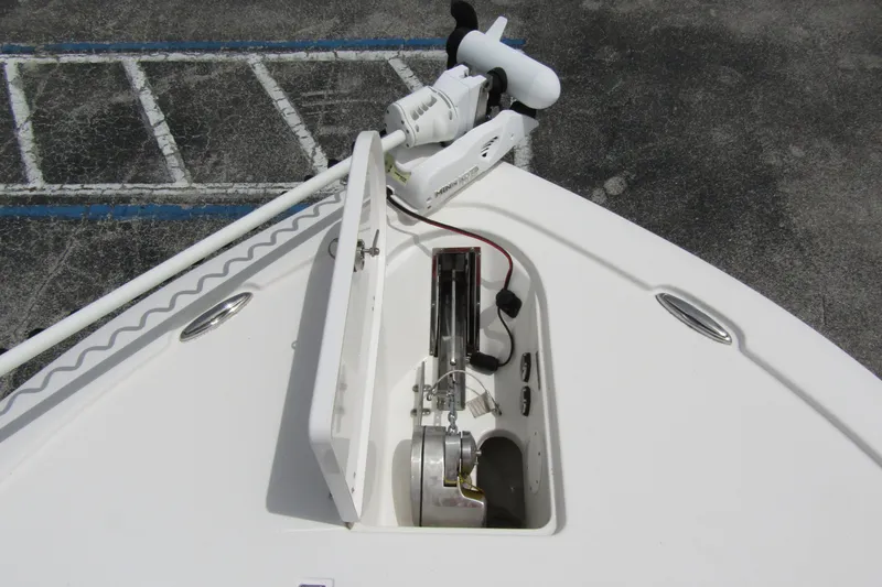 Slide: The Image of 2021 Tidewater 2700 Carolina Bay boat anchor compartment with open hatch. - 10