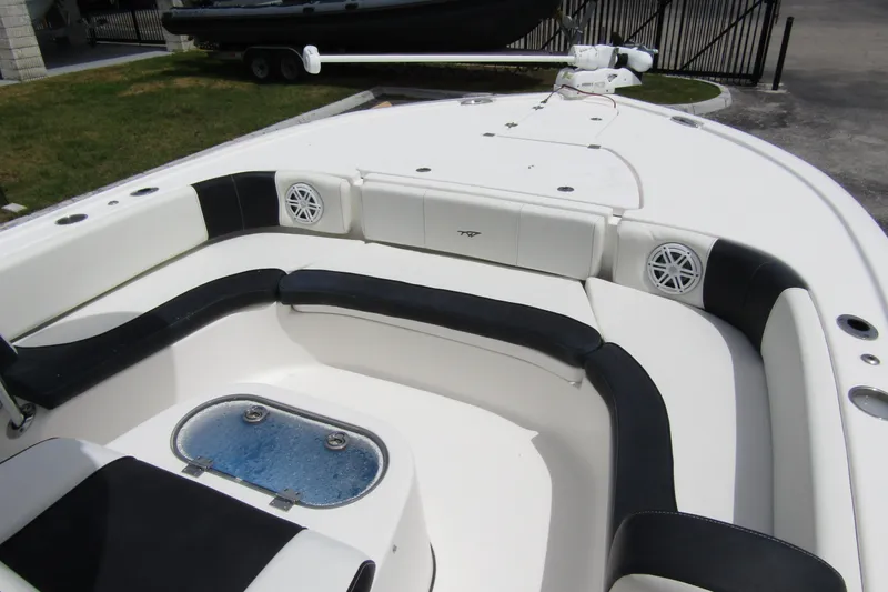 Slide: The Image of 2021 Tidewater 2700 Carolina Bay boat interior with seating and speakers. - 14