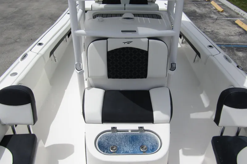 Slide: The Image of 2021 Tidewater 2700 Carolina Bay boat interior with seating and storage compartments. - 15