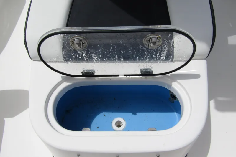 Slide: The Image of Open storage compartment on 2021 Tidewater 2700 Carolina Bay boat. - 17