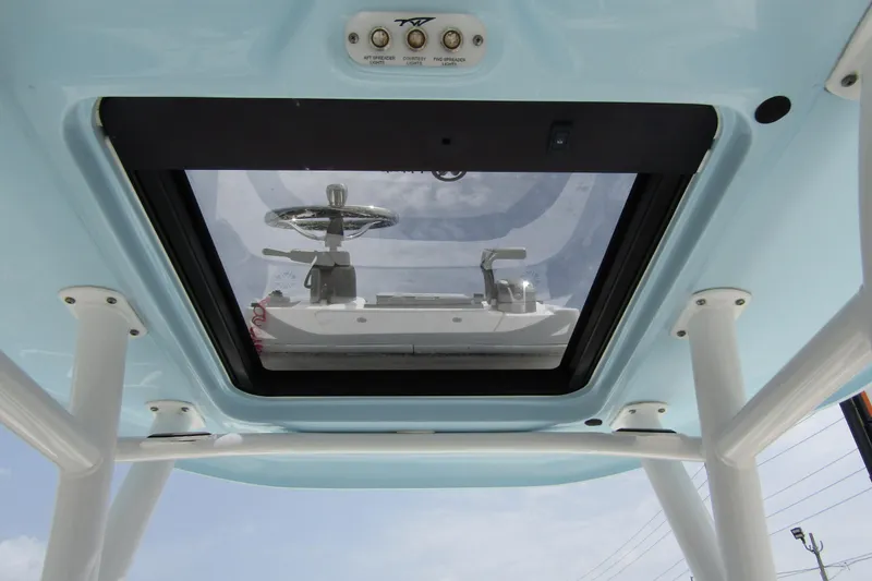 Slide: The Image of 2021 Tidewater 2700 Carolina Bay boat helm view through glass roof. - 29