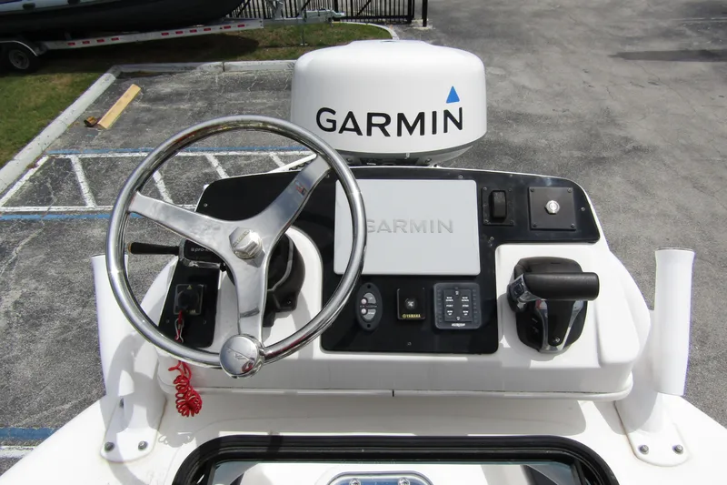 Slide: The Image of 2021 Tidewater 2700 Carolina Bay boat helm with Garmin navigation system. - 31