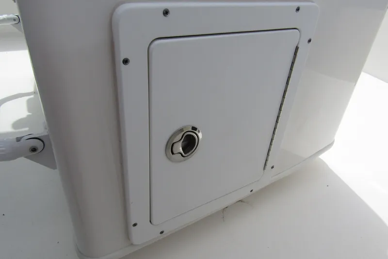 Slide: The Image of White storage compartment on 2021 Tidewater 2700 Carolina Bay boat. - 32