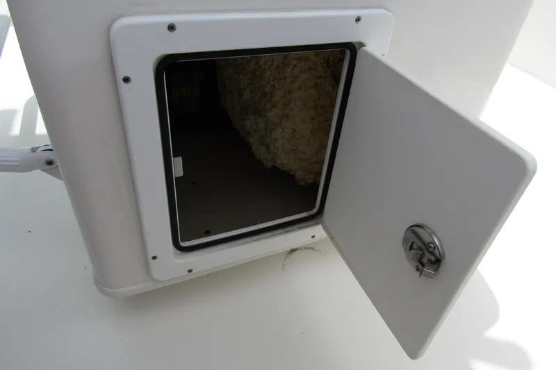 Slide: The Image of Open storage compartment on 2021 Tidewater 2700 Carolina Bay boat. - 33