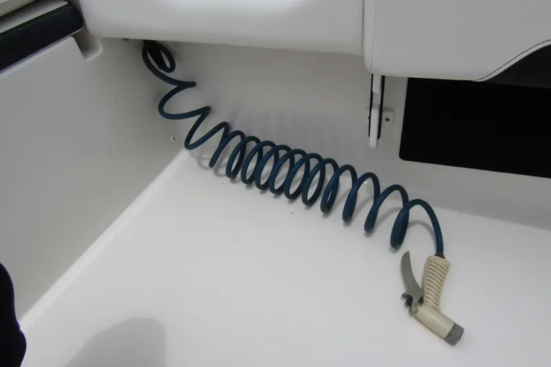 Slide: The Image of Coiled hose in 2021 Tidewater 2700 Carolina Bay boat interior. - 37