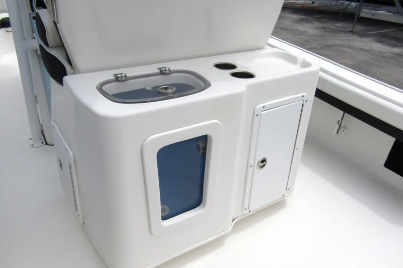Slide: The Image of 2021 Tidewater 2700 Carolina Bay boat console with storage and cup holders. - 38