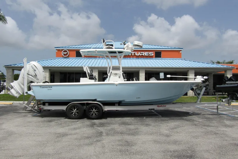 Slide: The Image of 2021 Tidewater 2700 Carolina Bay boat on trailer, parked outside dealership. - 4