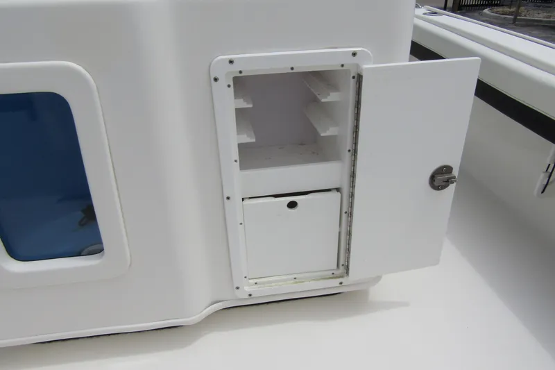 Slide: The Image of Open storage compartment on 2021 Tidewater 2700 Carolina Bay boat. - 40