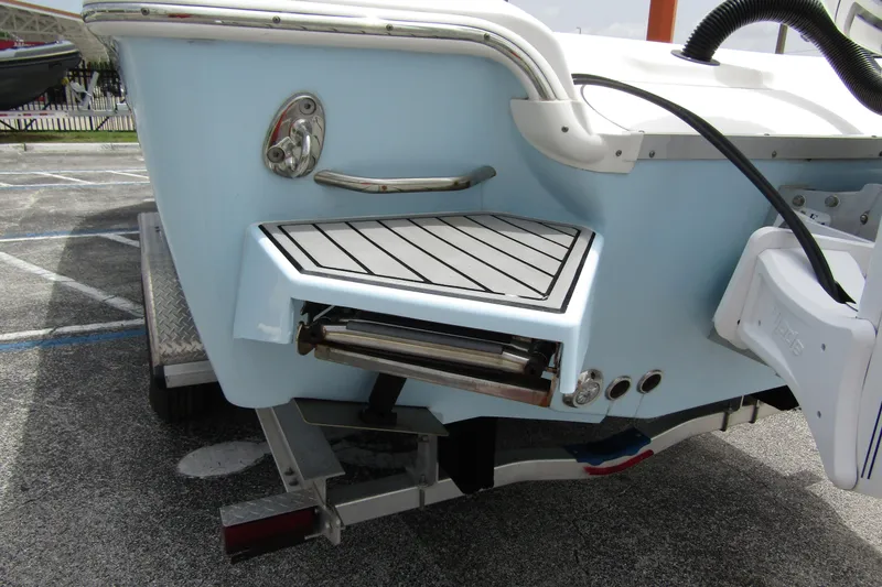 Slide: The Image of 2021 Tidewater 2700 Carolina Bay boat stern with swim platform and ladder. - 45